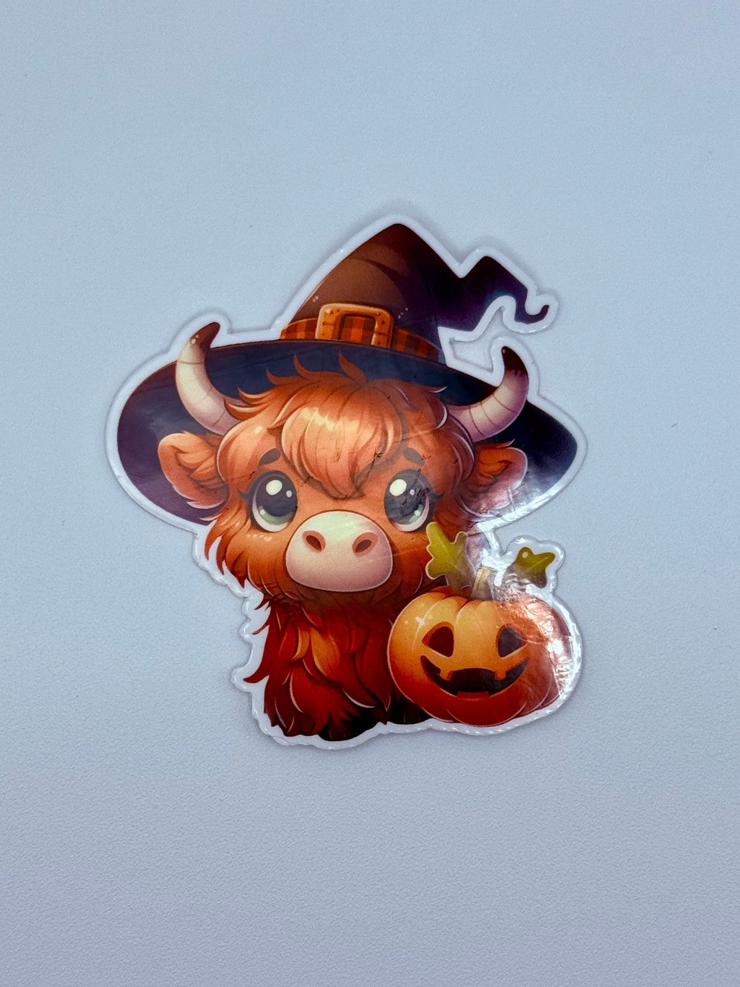 Highland Cow Witch Sticker – Cute Halloween Pumpkin Vinyl Decal, Spooky Fall Aesthetic, Kawaii Cow Sticker for Laptop & Water Bottle